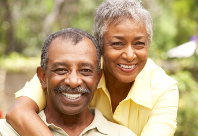 Smiling couple with dentures