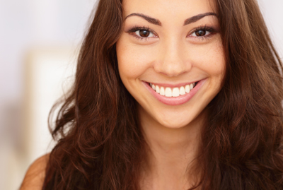 woman smiling with big bright smile