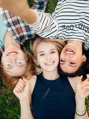 kids lying on grass