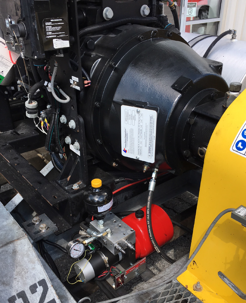 Logan self-adjusting hydraulically activated Bell Housing PTO installed on a Jetstream X series waterblaster. The Logan supplied power pack is pictured just below the clutch. Remote activation is now possible from the engine control panel or a remote control device. 