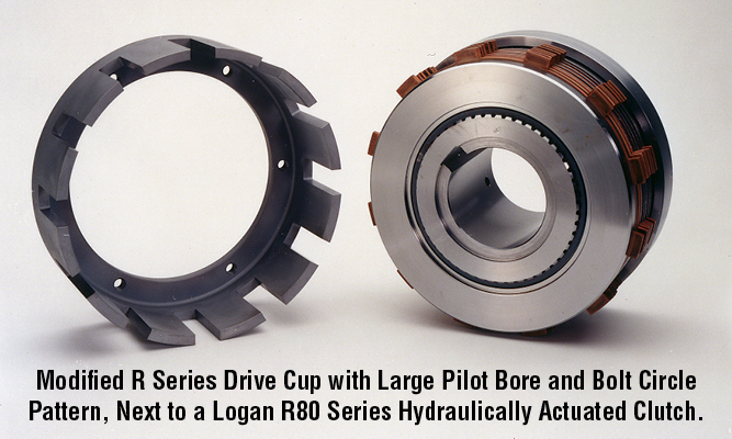 Modified R Series Drive Cup with Large Pilot Bore and Bolt Circle Pattern, Next to a Logan R80 Series Hydraulically Actuated Clutch.