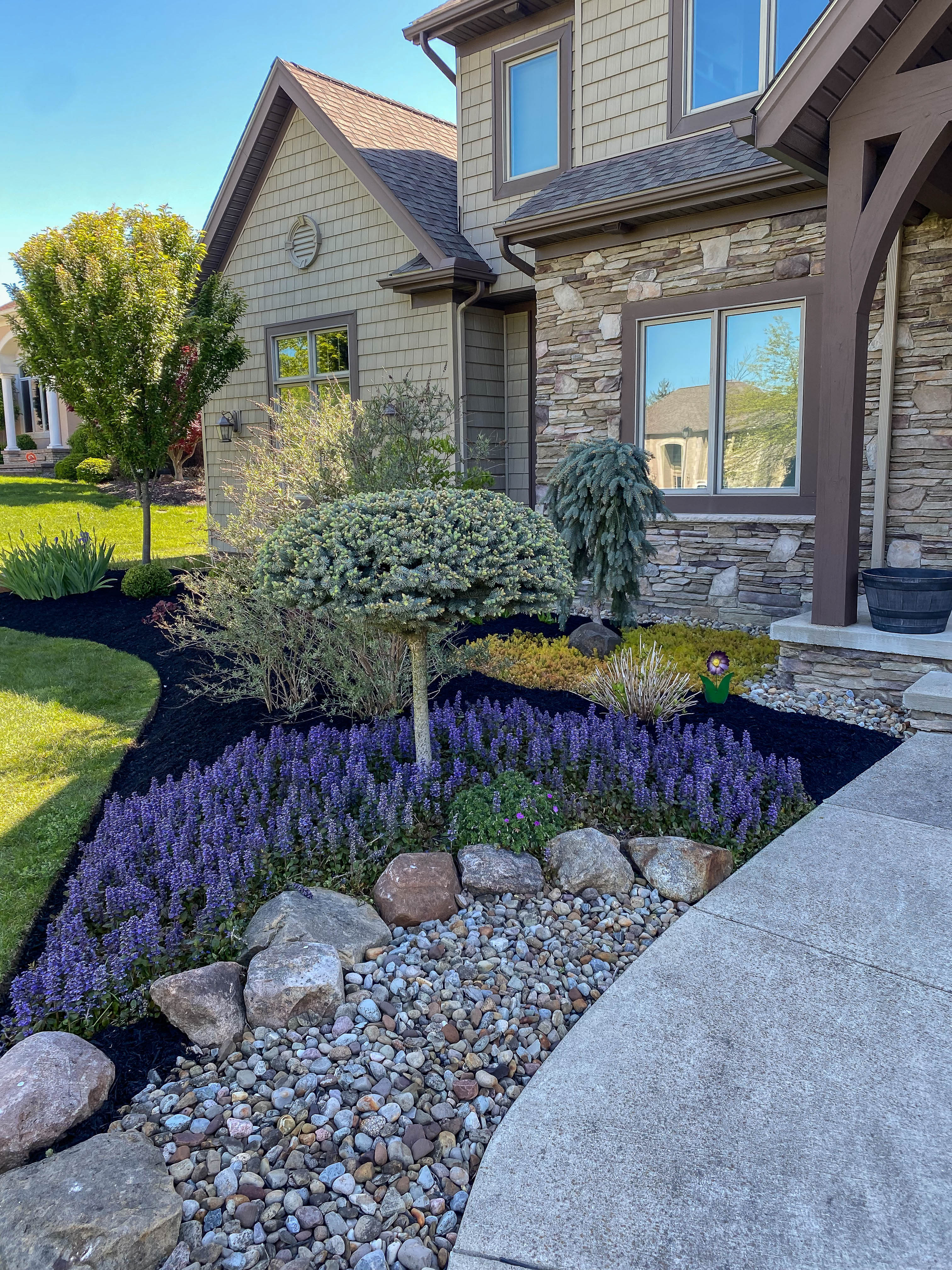 Photo of a landscaping design in front of a house